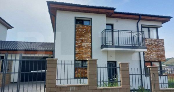 Casa cuplata prin garaj, 160mp utili, finisata, in zona Chin