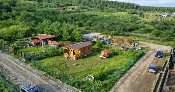 Casuta din lemn,cu 520mp teren intravilan,zona linistita,apr