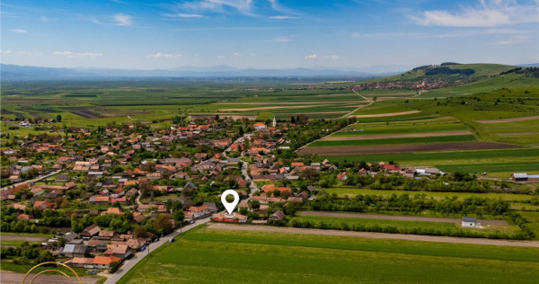 1.200mp teren si casa cu gradina inflorata, aproape de Targu