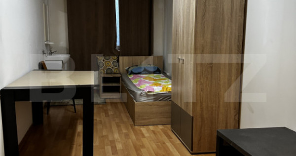 Două camere &icirc;ntr-o casă de inchiriat, cu acces la bucăt?