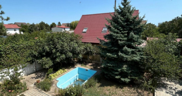 Povestea unei case la doar 200 m de valuri, cu piscină și