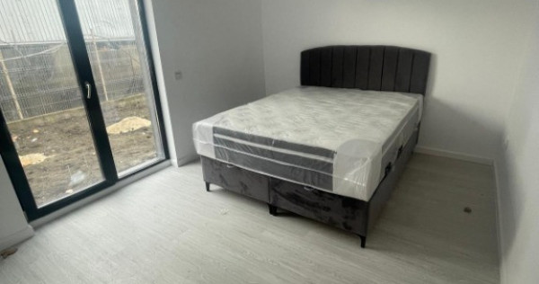 Apartament 2 camere cu curte proprie și 2 locuri de parcare